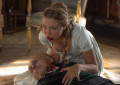 Annabelle (Jess Radomska) chewing her grandfather in Screen Gems' PRIDE AND PREJUDICE AND ZOMBIES.